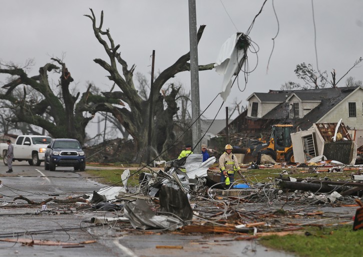 A house near the intersection of Routes 70 and 1 is seen after a powerful tornado struck, Tuesday, Feb. 23, 2016, in Paincourtville, La. A suspected tornado ripped through a Louisiana recreational vehicle park Tuesday, leaving a mangled mess of smashed trailers and killing at least one person, officials said. In neighboring Mississippi, authorities said one person died when a possible tornado hit a mobile home. (Michael DeMocker/NOLA.com The Times-Picayune via AP)