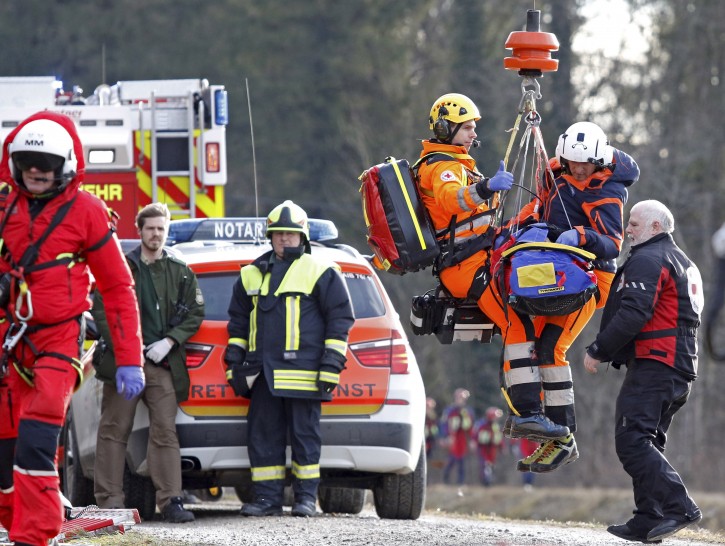 An injured person is rescued by emergency personnel at the site of a train accident near Bad Aibling,Â Germany, 09 February 2016. AP