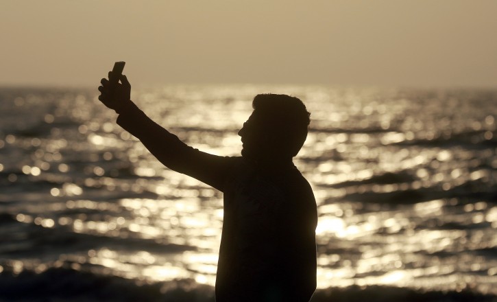  In this Monday, Feb. 22, 2016 picture, an Indian man takes a selfie in Mumbai's coastline. India is home to the highest number of people who have died while taking photos of themselves, with 19 of the worldâs 49 recorded selfie-linked deaths since 2014, according to San Francisco-based data service provider Priceonomics. The statistic may in part be due to Indiaâs sheer size, with 1.25 billion citizens and one of the worldâs fastest-growing smartphone markets. (AP Photo/Rafiq Maqbool)
