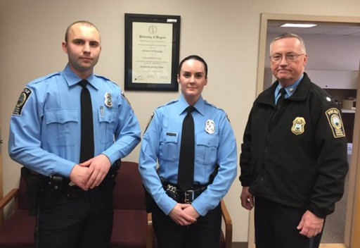 A photo provided by the Prince William County Police Department shows, from the left, Officer Steven Kendall, and Officer Ashley Guindon with Lt. Col. Barry Bernard, deputy chief of the Prince William County, Va., Police Department. Officer Ashley Guindon was shot and killed Saturday, Feb. 28, 2016, and two of her colleagues were wounded in a confrontation stemming from a call about an argument. Guindon and Kendall were sworn in on Friday, and Guindon was working her first shift with the Prince William County Police Department when she was killed. (Prince William County Police Department  via AP)