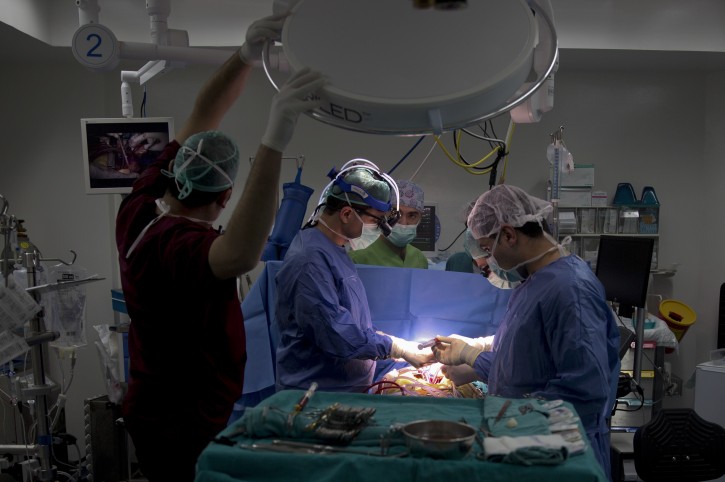 In this Thursday, Jan. 28, 2016 photo, Palestinian cardiovascular surgeon Saleem Haj-Yahia, left, performs open-heart surgery at An-Najah University hospital in the West Bank city of Nablus.  (AP Photo/Majdi Mohammed)