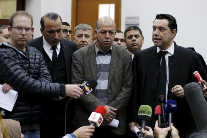 Hussein (C), father of Palestinian youth, Mohammed Abu Khudair speaks to the media after the sentencing of two of his son's murderers at the Jerusalem District Court in Jerusalem, February 4, 2016. REUTERS