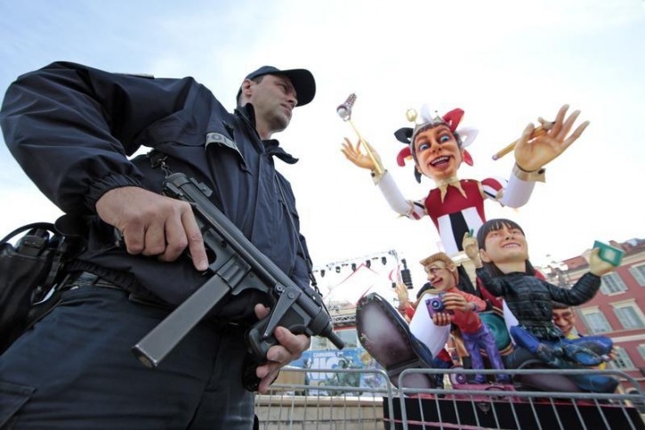 A police officer stands near the float of the King of Carnival as part of the "Vigipirate" security plan following Paris' deadly attacks in Nice, France, February 15, 2016  REUTERS/Eric Gaillard 