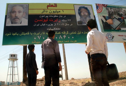 File: Afghans look at a billboard promising a reward for information leading to the recovery of US FBI ex-agent Robert Levinson, in Herat, near the Iranian border, in Afghanistan. EPA/JALIL REZAYEE