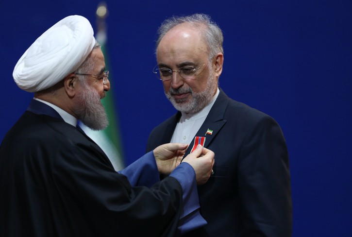 A handout picture made available by the presidential official website shows Iranian President Hassan Rouhani (L) awarding Iranian Foreign Minister Mohammad Javad Zarif with an honor medal in Tehran, Iran, 08 February 2016. EPA/PRESIDENTIAL OFFICIAL WEBSITE