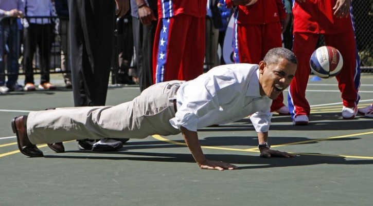 FILE - U.S. President Barack Obama does push-ups  on the South Lawn in Washington April 9, 2012. REUTERS