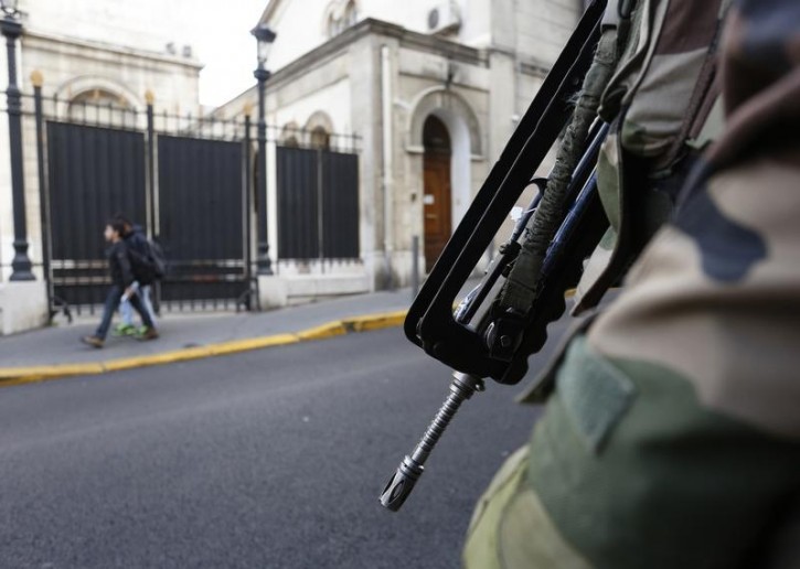FILE - A member of the French Foreign Legion secures the access to a Jewish synagogue in France. January 13, 2015.  Reuters