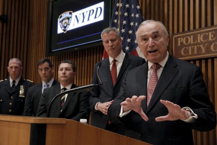 FILE - NYPD Police Commissioner William Bratton speaks, as New York Mayor Bill de Blasio looks on, during a news conference at New York City Police (NYPD) Headquarters in New York March 22, 2016. REUTERS/Brendan McDermid 