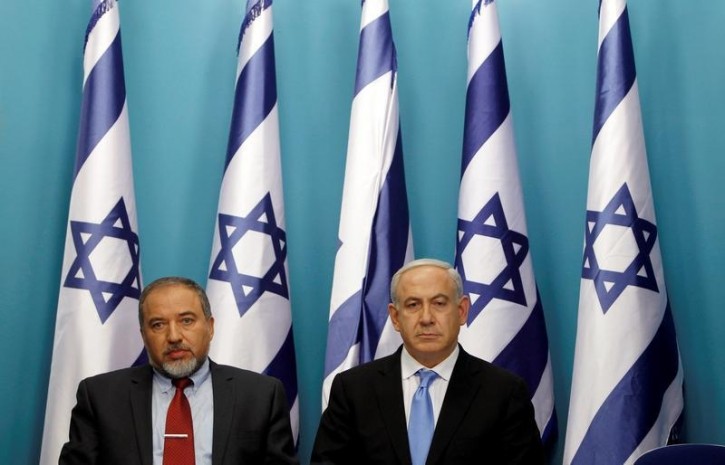 FILE - Israel's Prime Minister Benjamin Netanyahu (R) sits next to Foreign Minister Avigdor Lieberman after delivering a statement in Jerusalem November 21, 2012. REUTERS/Baz Ratner/File Photo