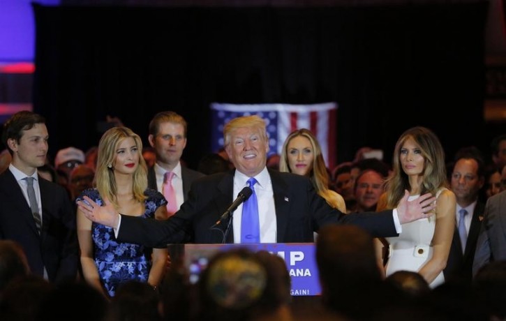 Republican U.S. presidential candidate Donald Trump speaks as (L-R) his son-in-law Jared Kushner, his daughter Ivanka, his son Eric, Eric's wife Lara Yunaska and Trump's wife Melania  look on, during a campaign victory party after rival candidate Senator Ted Cruz dropped out of the race for the Republican presidential nomination following the results of the Indiana state primary, at Trump Tower in Manhattan, New York, U.S., May 3, 2016. REUTERS/Lucas Jackson