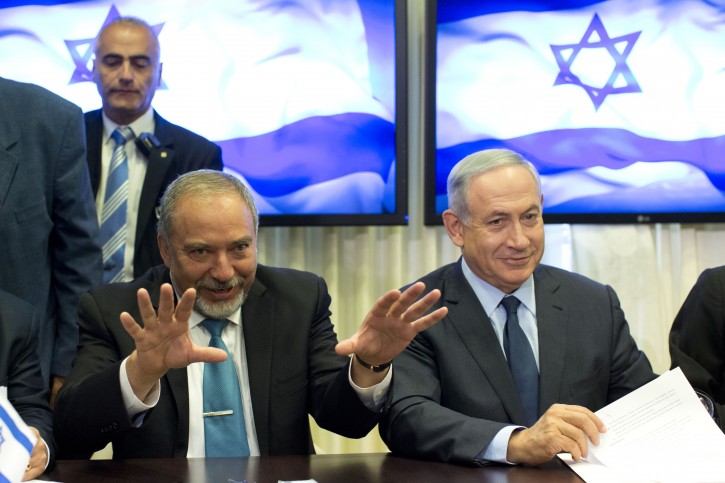 Israeli Prime Minister Benjamin Netanyahu (C-R) and former foreign minister Avigdor Lieberman (C-L) attend the signing of coalition agreements at the Knesset (Israeli parliament) in Jerusalem, Israel, 25 May 2016. EPA