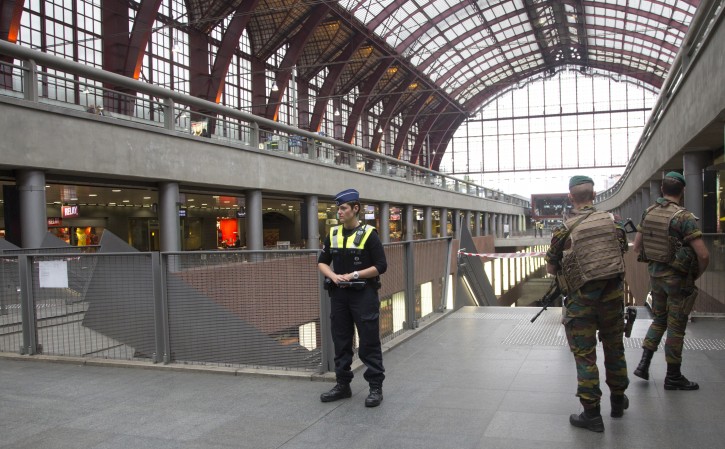 Police and Belgian Army soldiers guard a cordon at Antwerp Central train station in Antwerp, Belgium on Saturday, June 18, 2016. Police and the bomb squad unit responded to a suspect package in the Antwerp station while the Belgian federal prosecutor's office said early Saturday that homes and car ports were searched in 16 municipalities, mostly in and around Brussels in an anti-terror sweep. (AP Photo/Virginia Mayo)