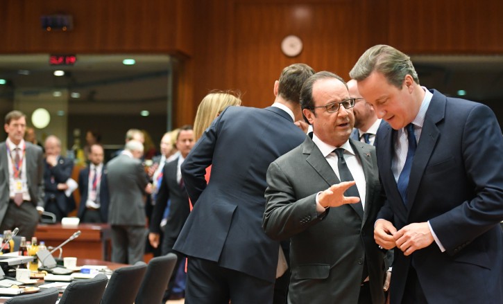 British Prime Minister David Cameron, right, speaks with French President Francois Hollande during a round table meeting at an EU summit in Brussels on Tuesday, June 28, 2016. EU heads of state and government meet Tuesday and Wednesday in Brussels for the first time since Britain voted to leave the European Union, throwing British and European politics into disarray. (AP Photo/Geert Vanden Wijngaert)