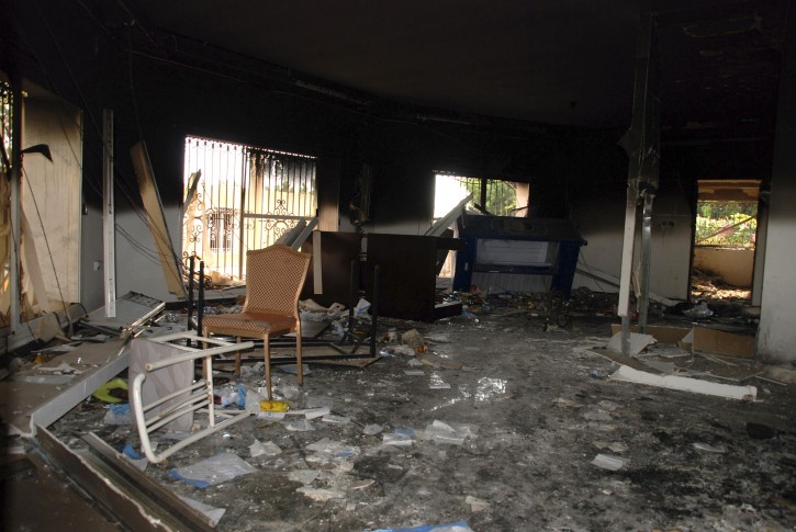 FILE - This Sept. 12, 2012 file photo shows glass, debris and overturned furniture are strewn inside a room in the gutted U.S. consulate in Benghazi, Libya, after an attack that killed four Americans, including Ambassador Chris Stevens. (AP Photo/Ibrahim Alaguri, File)