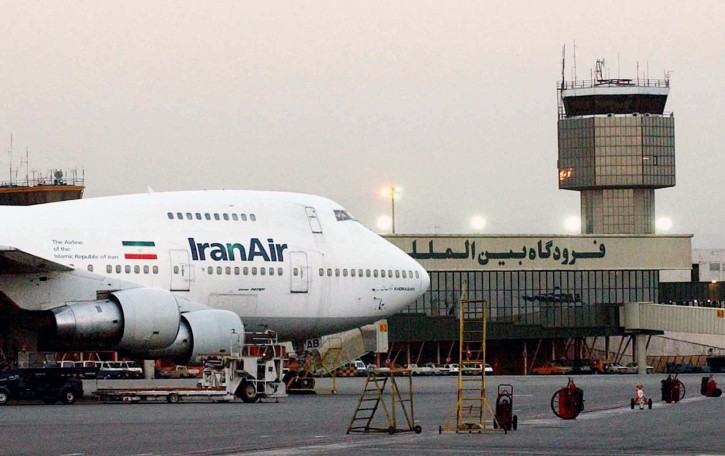 FILE - In this June 2003 file photo, a Boeing 747 of Iran's national airline is seen at Mehrabad International Airport in Tehran. Boeing Co. has confirmed signing an agreement with Iran Air âexpressing the airline's intentâ to buy its aircraft. In a statement Tuesday to The Associated Press, Boeing said it signed the agreement âunder authorizations from the U.S. government following a determination that Iran had met its obligations under the nuclear accord reached last summer.â (AP Photo/Hasan Sarbakhshian, File)