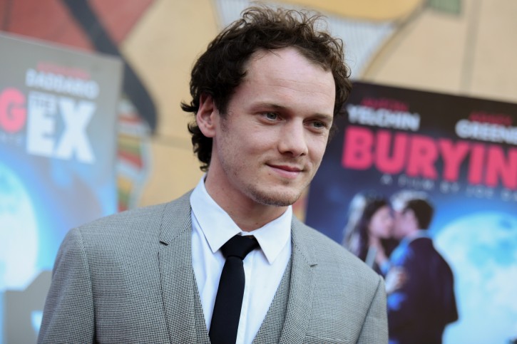Anton Yelchin arrives at a special screening of "Burying the Ex" held at Grauman's Egyptian Theatre on Thursday, June 11, 2015, in Los Angeles. (Photo by Richard Shotwell/Invision/AP)