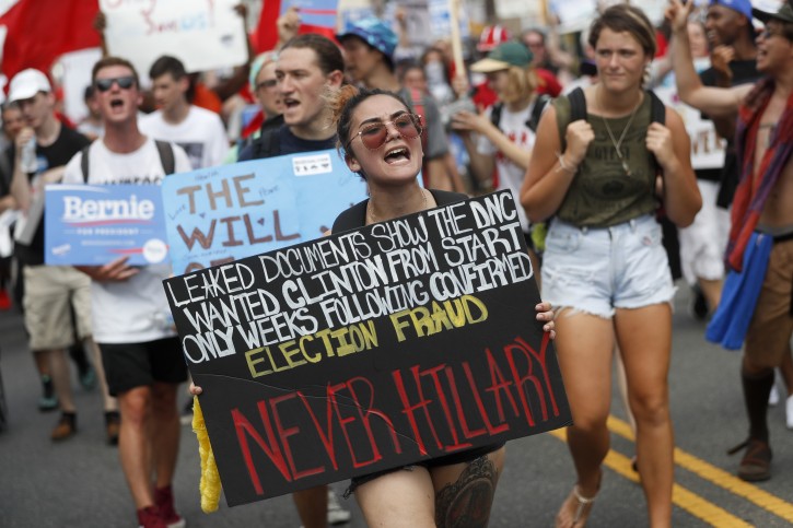 Supporters of Sen. Bernie Sanders, I-Vt., march during a protest in downtown Philadelphia, Monday, July 25, 2016, on the first day of the Democratic National Convention. On Sunday, Debbie Wasserman Schultz announced she would step down as DNC chairwoman at the end of the party's convention, after emails presumably stolen from the DNC by hackers were posted to the website Wikileaks. (AP Photo/John Minchillo)