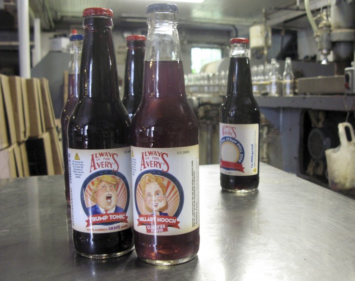 Samples of Avery's Beverages' latest specialty sodas, Trump Tonic, left, and Hillary Hooch, stand on a table at the company's bottling facility, Monday, July 11, 2016, in New Britain, Conn. This is the third presidential race that company created candidate-based sodas and held a straw poll based on sales. During the last two cycles, Barack O'Berry beat John McCream and Cream de Mitt. (AP Photo/Pat Eaton-Robb)
