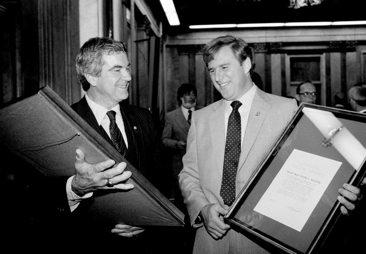 FILE - In this Sept. 23, 1981 file photo, then-Chief of White House Secret Service detail, Jerry Parr, left, and Secret Service agent Timothy McCarthy hold valor awards they received from Treasury Secretary Donald Regan in Washington for their part in the attempt on President Reagan's life. Parr is the agent that pushed the president into his car as he was being shot and McCarthy was shot in the attempt. John Hinckley Jr. shot four people outside a Washington hotel on March 30, 1981, but two of his victims understandably got most of the attention: President Ronald Reagan and his press secretary, James Brady. Former Secret Service agent McCarthy and former District of Columbia police officer Thomas Delahanty, both of whom took bullets to protect the president. (AP Photo/Ron Edmonds, File)