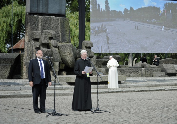 Pope Francis, right, prays as Poland's chief rabbi Michael Schudrich, left, stands next to Rev. Stanislaw Ruszala, a priest from a village where the Nazis killed a Polish family because it was protecting Jews. who was chosen to read a psalm in Polish during the papal visit to the site of the German Nazi death camp of Birkenau in Oswiecim, Poland, Friday, July 29, 2016. During Pope Francisâ visit to Auschwitz-Birkenau on Friday there was an encounter with 25 Christian Poles who rescued Jews during the Holocaust _ a powerfully symbolic meeting that Polandâs chief rabbi played a key role in orchestrating.(AP Photo/Tomasz Pielesz/ Auschwitz Museum)