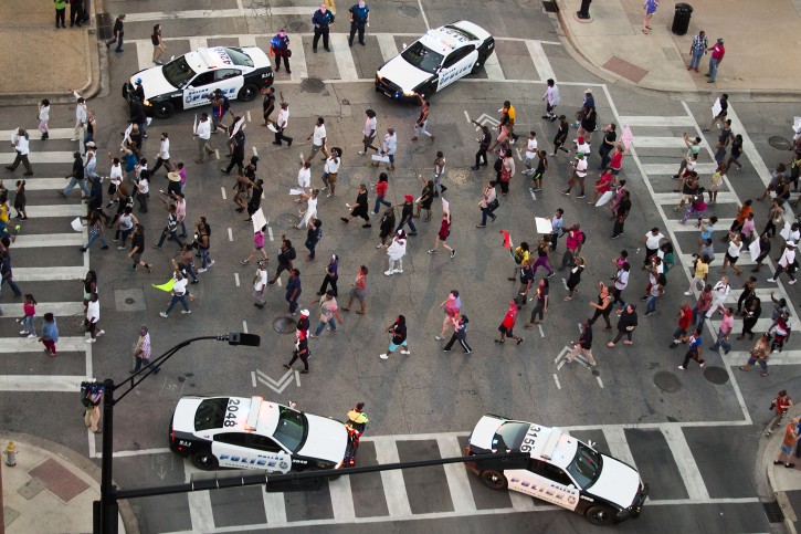 Protesters march during a Black Live Matter rally in downtown Dallas on Thursday, July 7, 2016. Multiple media outlets report that shots were fired later Thursday during the protest over two recent fatal police shootings of black men. (Smiley N. Pool/The Dallas Morning News via AP)