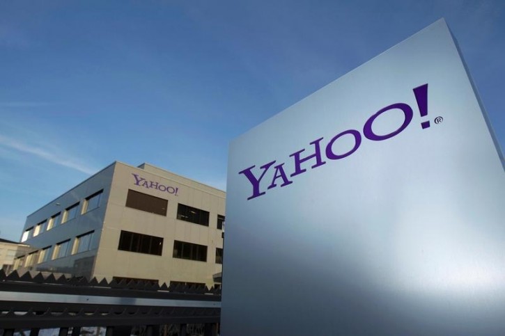 FILE - A Yahoo logo is pictured in front of a building in Rolle, 30 km (19 miles) east of Geneva, December 12, 2012.   REUTERS/Denis Balibouse/File photo
