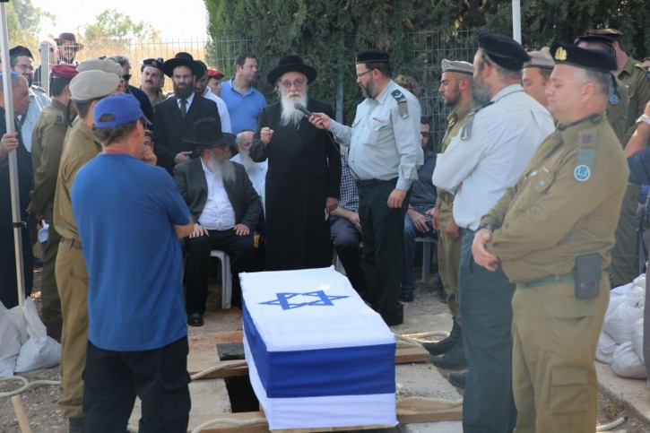 amily and friends mourn at the funeral of 20-year old IDF soldier Shlomo Rindenow, on July 18, 2016. Rindenow was killed along with another Israeli soldier yesterday when a grenade accidentally exploded near an army post on the Golan Heights.