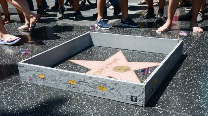 A handout image provided by the artist called Plastic Jesus on 20 July 2016 shows sightseeers looking at Donald Trump's Star on the Hollywood Walk of Fame, in Hollywood, California, USA, 19 July 2016. EPA