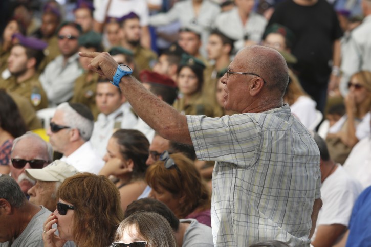 A Parent who lost his son in the war raise shout criticism towards Prime Minister Benjamin Netanyahu during a state memorial ceremony marking two years since the  2014 Gaza war "Operation Protective Edge" at Mount Herzl military cemetery in  in Jerusalem, Israel, 26 July 2016.EPA/ABIR SULTAN
