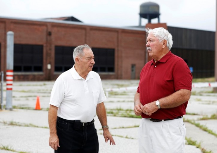 Gerald Poor (L) talks to long time friend and former co-worker Larry Terrell in front of the now shuttered BorgWarner factory in Muncie, Indiana, U.S., August 13, 2016. Poor worked at the factory for over 40 years. REUTERS/Chris Bergin