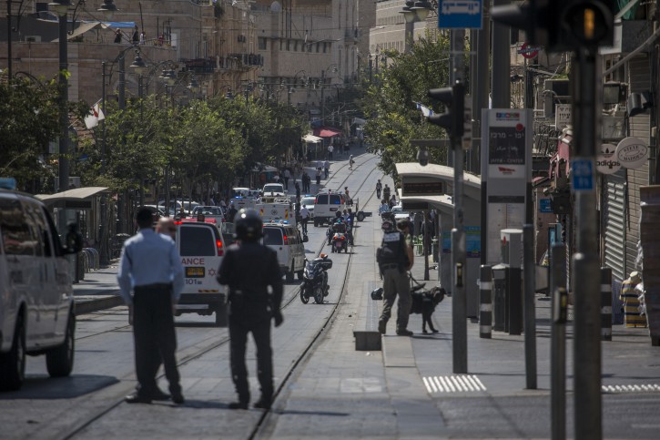 FILE  - Israeli security at the scene where a suspect was found with explosives in his bag at the lightrail station on King George street in central Jerusalem, on July 17, 2016. A young Palestinian was stopped by lightrail security who admitted to have explosives and planned to bomb the train. Photo by Hadas Parush/Flash90 
