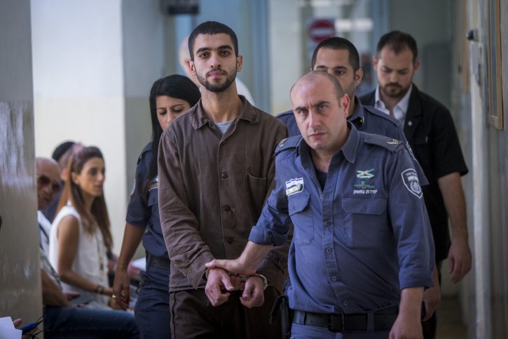 Ali Abu Hassan, A palestinian student from hebron who was arrested two weeks ago with explosives in his bag at the lightrail station on King George street is brought for a court hearing at the Jerusalem Magistrates Court, on August 2, 2016. Photo by Yonatan Sindel/Flash90 