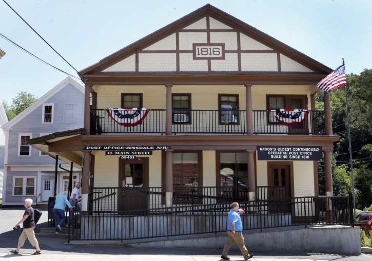 The oldest continuously operating post office in the U.S., the Hinsdale Post Office is seen Thursday Aug. 4, 2016 in Hinsdale, New Hampshire. The post office is celebrating it's 200th birthday. (AP Photo/Jim Cole)