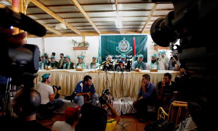 File - In this Saturday, Aug. 13, 2005 file photo, media covers Hamas press conference in Gaza City. (AP Photo/Hatem Moussa, File)