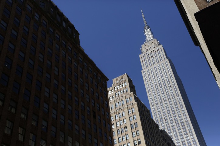 FILE -- This March 9, 2016 file photo, shows the Empire State Building, in New York. Qatar's sovereign wealth fund has made an iconic purchase in America -- a stake in the company owning New York's Empire State Building. The Empire State Realty Trust Inc., which manages the building, announced late Tuesday, Aug. 23, 2016, that the Qatar Investment Authority purchased a 9.9-percent stake in the company for $622 million. (AP Photo/Mark Lennihan, File)