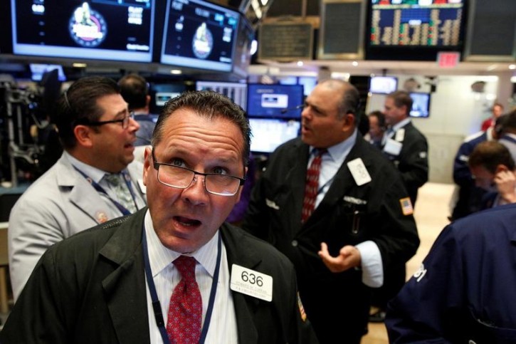 Traders work on the floor of the New York Stock Exchange (NYSE) in New York City, U.S., August 17, 2016.  REUTERS/Brendan McDermid 