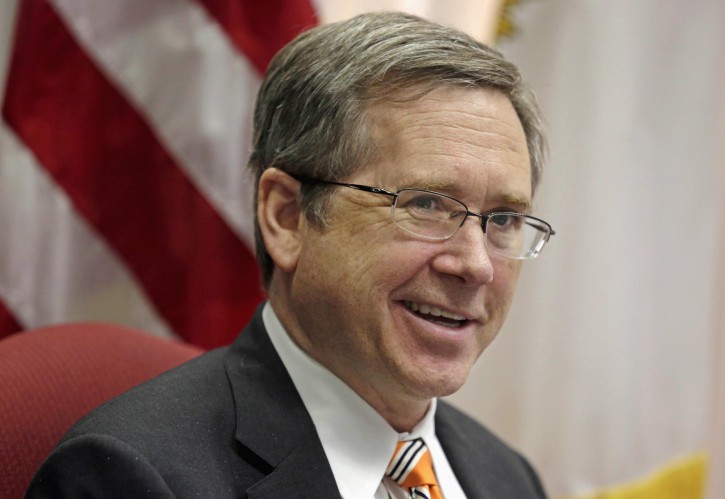 FILE - In this June 9, 2014, file photo, U.S. Sen. Mark Kirk R-Ill., speaks in his office in Chicago. Kirk once again raised eyebrows with a comment about President Barack Obama, saying the president was "acting like the drug deal in chief" when his administration late last week said a $400 million cash payment to Iran was linked to the release of American prisoners. (AP Photo/M. Spencer Green, File)