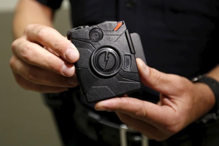 FILE - Los Angeles Police Department (LAPD) information technology bureau officer Jim Stover displays the new body cameras to be used by the LAPD in Los Angeles, California August 31, 2015.  REUTERS/Al Seib/Pool/Files