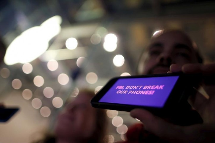 FILE - A man displays a protest message on his iPhone at a small rally in support of Apple's refusal to help the FBI access the cell phone of a gunman involved in the killings of 14 people in San Bernardino, in Santa Monica, California, U.S. in this February 23, 2016 file photo.  REUTERS/Lucy Nicholson/File Photo