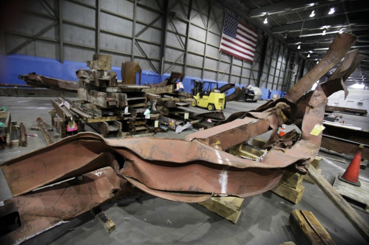 Twisted beams and other remains from attacks at the World Trade Center sit in Hangar 17 at New York's John F. Kennedy International Airport, Wednesday, March 23, 2011. (AP Photo/Richard Drew)