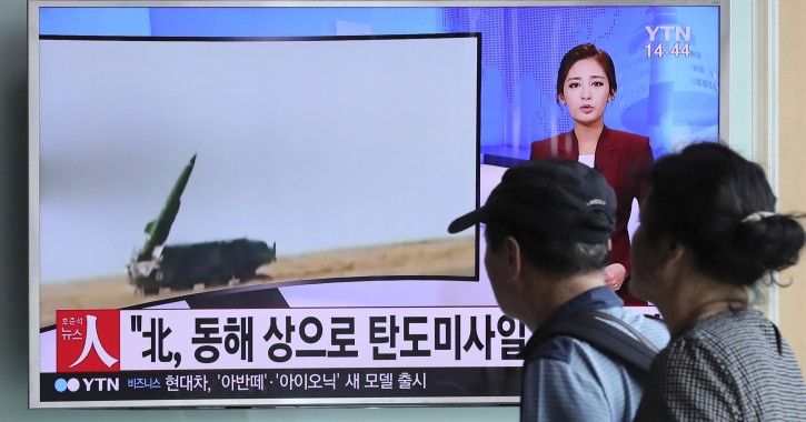 People watch a TV news program reporting about a missile launch of North Korea, at the Seoul Train Station in Seoul, South Korea, Monday, Sept. 5, 2016. North Korea fired three ballistic missiles off its east coast Monday, South Korea's military said, in a show of force timed to the G-20 economic summit in China. The letters read "North Korea, the ballistic missiles to east coast." (AP Photo/Lee Jin-man)