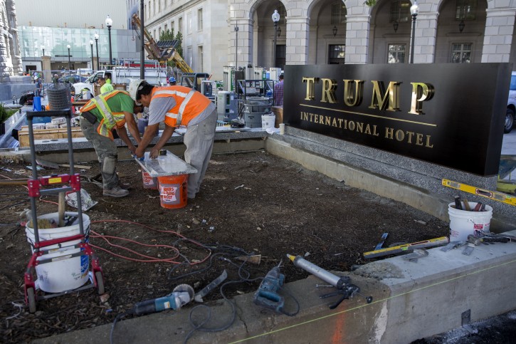Construction workers continue work on the new Trump International Hotel on Pennsylvania Avenue in Washington, DC, USA, 12 September 2016. The Trump International Hotel opens today, with its grand opening ceremonies scheduled for 24 October 2016.  EPA/SHAWN THEW