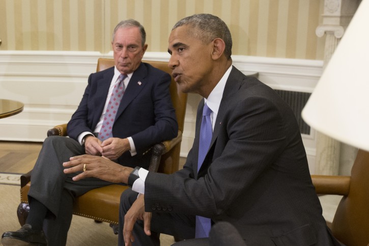 US President Barack Obama (R) sits beside former Mayor of New York City Michael Bloomberg (L) while delivering remarks to members of the news media before a meeting on the Trans-Pacific Partnership (TPP); with business, government, and national security leaders in the Oval Office of the White House, in Washington, DC, USA, 16 September 2016.  EPA/MICHAEL REYNOLDS