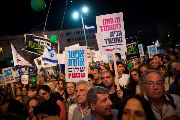Israelis attend a rally marking 21 years since the assassination of late Israeli Prime Minister Yitzhak Rabin, at Tel Avivs Rabin Square on November 5, 2016, Yitzhak Rabin was assassinated on November 4, 1995 by an Israeli extremist during a pro-peace rally in Tel Aviv. Photo by Miriam Alster/Flash90 