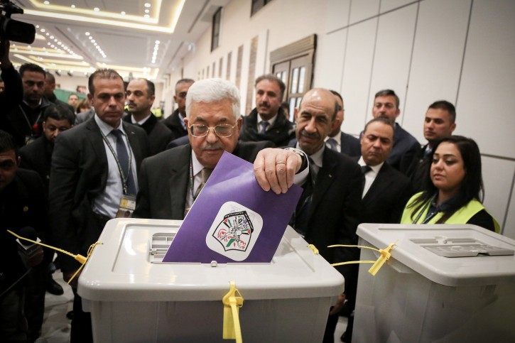 Palestinian president Mahmud Abbas casts his vote at the Muqataa, the Palestinian Authority headquarters, in the West Bank city of Ramallah on December 03, 2016.