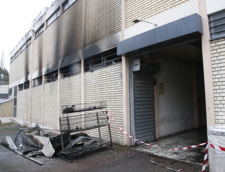 The back of a kosher market is pictured after a fire broke out in Creteil, south of Paris, Tuesday, Jan.9, 2018. French officials say the fire broke out at the kosher market south of Paris that was vandalized with anti-Semitic graffiti last week. (AP Photo/Michel Euler)