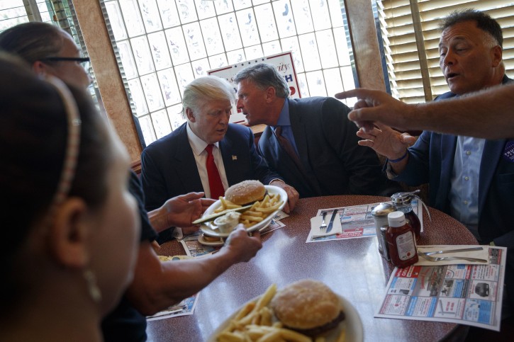 Republican presidential candidate Donald Trump sits down for lunch during a visit to the Boulevard Diner, Monday, Sept. 12, 2016, in Dundalk, Md. (AP Photo/Evan Vucci)