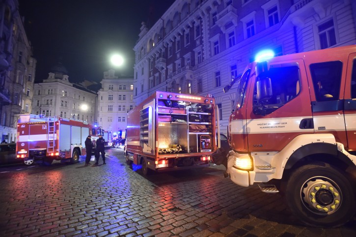 Firefighters and rescuers work at the scene of a hotel fire in downtown Prague on Saturday, Jan. 20, 2018. Czech officials say a hotel fire in downtown Prague has killed at least two people. (Vit Simanek/CTK via AP)