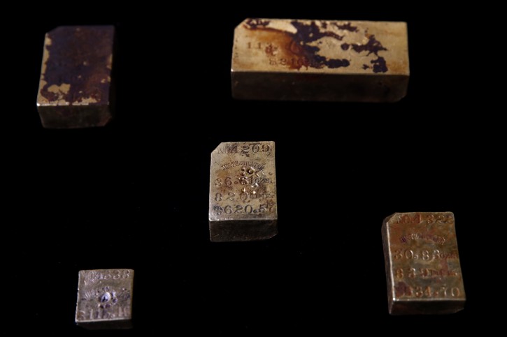Bars recovered from the S.S. Central America steamship that went down in a hurricane in 1857 are seen in a laboratory Tuesday, Jan. 23, 2018, in Santa Ana, Calif. More than $50 million worth of gold bars, coins and dust described as the greatest lost treasure in U.S. history is about to make its public debut in California. (AP Photo/Jae C. Hong)