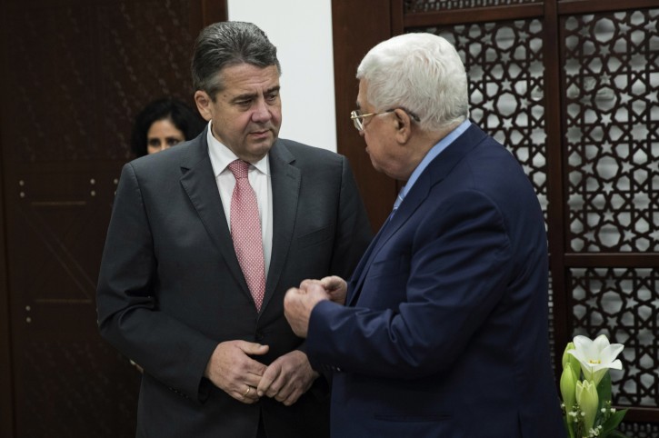 German Foreign Minister Sigmar Gabriel, left, meets with the Palestinian President Mahmoud Abbas, in the West Bank Town of Ramallah, Wednesday, Jan. 31, 2018. (Atef Safadi/Pool Photo via AP)